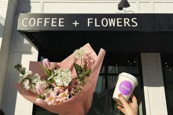 Foxglove Cafe Bouquet and coffee cup outside of a cafe